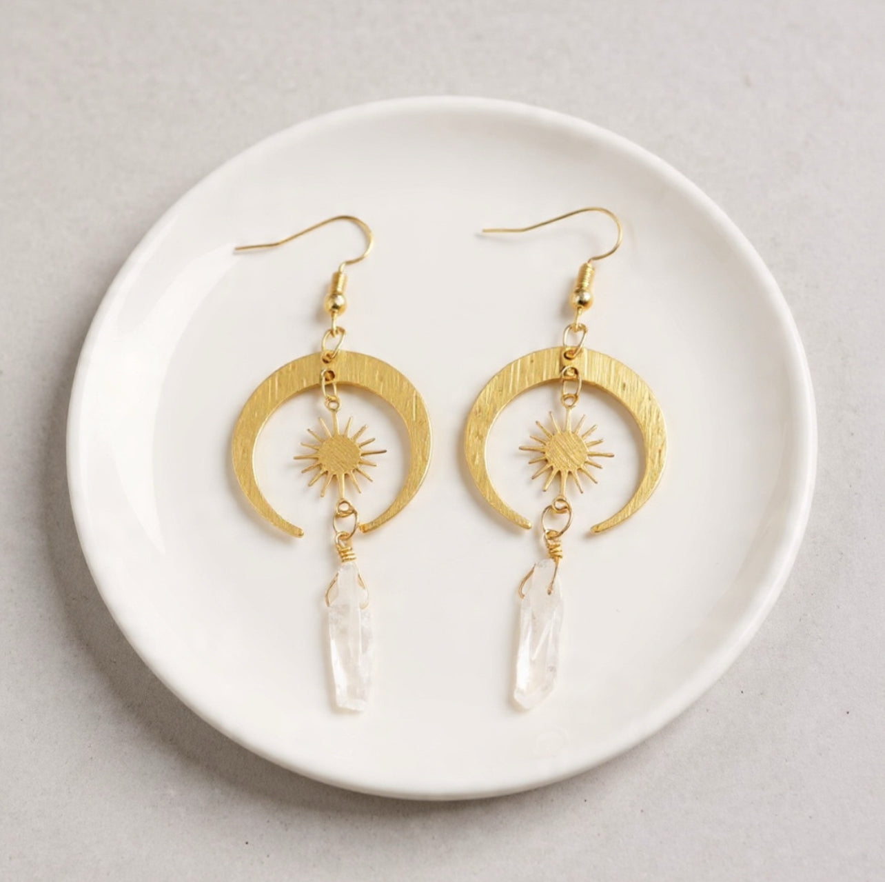 Gold earrings with celestial design on a white plate bohemian style jewellery spiritual Australian business 